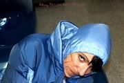 Simone tied and gagged in a shiny nylo skisuit