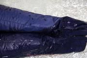 Nina tied and gagged in a shiny nylon down jacket and rainpants