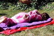 Julia tied and gagged in a shiny nylon skisuit