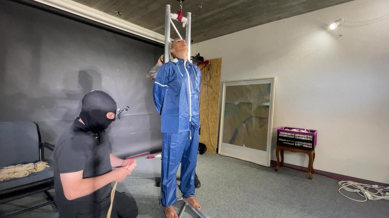 Ms Ungeniert Tied, Gagged, Suspended Ind A Shiny Nylon Rainsuit And Finally Bullwhipped