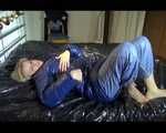Pia wearing a shiny nylon rain pants and a bra dressing herself with a blue PAMY down jacket and lolling on bed (Video)