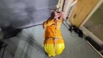Marie tied and gagged in shiny nylon rainwear