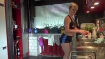 Watching sexy COURTNEY wearing a darkblue shiny nylon shorts and a top while preparing coffee and doing her housework (Video)