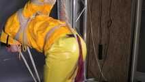 Marie tied and gagged in shiny nylon rainwear