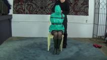 Ana in pvc jacket backwards