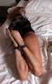 Barefoot Dolly is being hogtied and gagged on-screen, resisting at all costs
