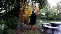 Fur coat and rubber boots - naked in the park