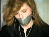 DOLL FACE APRIL TAPES UPS, GAGS & HANDCUFFS HERSELF (D20-11)