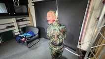 Ms Ungeniert tied and gagged in shiny nylon Rainwear 