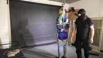 Myxxxy bound and gagged, wearing shiny nylon shorts and a windbreaker