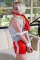 Nina tied and gagged in shiny red nylon shorts