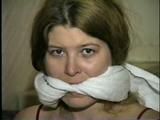 ONE IS STOCKING GAGGED, WET WRISTS GAGGED, BAREFOOT, TOE-TIED, GAGS HERSELF & IS HANDGAGGED (D43-12)