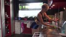 Watching sexy COURTNEY wearing a darkblue shiny nylon shorts and a top while preparing coffee and doing her housework (Video)