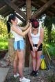 Jill tied and gagged by her friend in shiny shorts