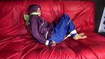 SANDRA being tied and gagged on a sofa with ropes and a clothgag wearing a sexy blue shiny nylon rain pants and a purple rain jacket  (Video)