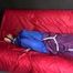 SANDRA being tied and gagged on a sofa with ropes and a clothgag wearing a sexy blue shiny nylon rain pants and a purple rain jacket  (Video)