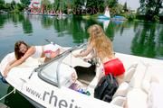 Stella and Leonie having a good time together on a boat sinbathing wearing sexy shiny nylon shorts and bikini-tops (Pics)