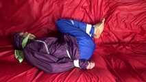 SANDRA being tied and gagged on a sofa with ropes and a clothgag wearing a sexy blue shiny nylon rain pants and a purple rain jacket  (Video)