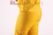 Watching sexy Jill wearing a sexy yellow shiny nylon rainwearcombination and a red shiny nylon raincoat posing for you (Pics)