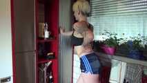 Watching sexy COURTNEY wearing a darkblue shiny nylon shorts and a top while preparing coffee and doing her housework (Video)