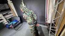 Ms Ungeniert tied and gagged in shiny nylon Rainwear 