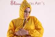 Watching sexy Jill wearing a sexy yellow shiny nylon rainwearcombination and a red shiny nylon raincoat posing for you (Pics)