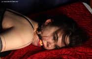 Janice tied on bed