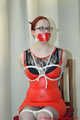 Gefesselt im Wetlook Outfit und verschiedene Knebel