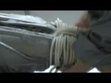 Simone  with an shiny silver PVC sauna suit tied and gagged by Sophie in an bath tub (Video)