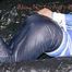 ***SEXY SANDRA*** wearing a supersexy skinny shiny nylon pants and a lightblue shiny nylon rain jacket being bound on a sofa with ropes and a ball gag (Pics)