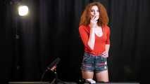 Skinny girl with wild red hair loves smoking a 120mm between the shooting