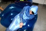 Simone tied and gagged in a shiny nylo skisuit