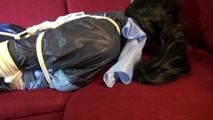 Lucy tied and gagged on a red sofa wearing a supersexy blue shiny nylon pants and a blue rain jacket (Video)