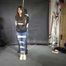 Poor Marie bound and gagged in a shiny nylon Windbreaker