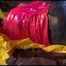 Lucy tied and gagged on a pillory on a bed wearing a supersexy crazy sensation downwear (Video)