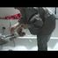Simone  with an shiny silver PVC sauna suit tied and gagged by Sophie in an bath tub (Video)