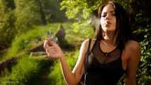 18 years old Tanya is smoking 120mm cork cigarette outdoors