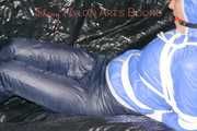 ***SEXY SANDRA*** wearing a supersexy skinny shiny nylon pants and a lightblue shiny nylon rain jacket being bound on a sofa with ropes and a ball gag (Pics)