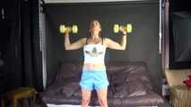 Watching sexy Sandra wearing a sexy lightblue shiny nylon shorts and a white top during her workout with barbells (Video)