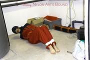 Shelly tied and gagged in shiny nylon rainwear