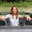 Stella tied and gagged in a grey shiny nylon catsuit in a car