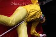 Watching sexy Pia being tied and gagged with ropes on a bed and a clothgag wearing sexy yellow shiny nylon rainwear (Pics)