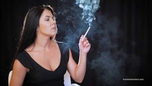 Delicious lady Tanya is engrossed in smoking a 120mm cigarette