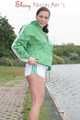 Watching ***OUR SEXY ARCHIVE MODEL JENNY*** wearing a sexy white shiny nylon shorts and a green shiny nylon rain jacket posing for you (Pics)