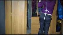 Pia tied with ropes overhead and gagged with a ballgag wearing sexy rain pants and a rain jacket (Video)