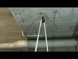 a video with Nicole tied and gagged in a shiny silver PVC sauna suit