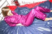 Alina preparing her bed for relaxing and lolling on the bed wearing a sexy shiny nylon rain pants and a rain jacket (Pics)