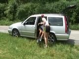 One of our archive girls ties and gagges the other one outdoor in car wearing shiny nylon shorts (Video)
