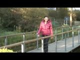 Enni taking a walk while wearing a sexy red down jacket and a shorts beneath the jeans (Video)