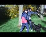 Jill and a friend of her playing with eachother in the garden while wearing shiny nylon rainwear (Video)